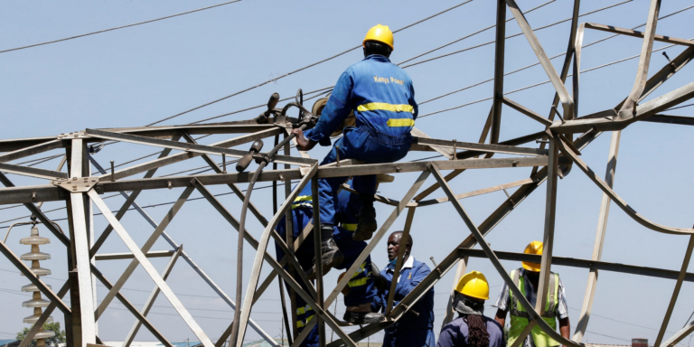 Kenya power workers working on a power line PHOTO/Standard