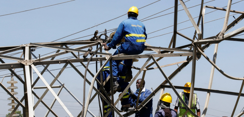 Kenya power workers working on a power line PHOTO/Standard