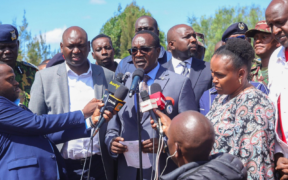 Education CS Julius Ogamba flanked by other leaders, PS Education Julius Bitok and Interior CS Kipchumba Murkomen speaking at Utumishi Girls Academy in Gilgil. PHOTO/ NPS