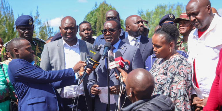 Education CS Julius Ogamba flanked by other leaders, PS Education Julius Bitok and Interior CS Kipchumba Murkomen speaking at Utumishi Girls Academy in Gilgil. PHOTO/ NPS