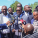 Education CS Julius Ogamba flanked by other leaders, PS Education Julius Bitok and Interior CS Kipchumba Murkomen speaking at Utumishi Girls Academy in Gilgil. PHOTO/ NPS