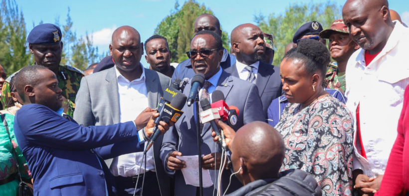 Education CS Julius Ogamba flanked by other leaders, PS Education Julius Bitok and Interior CS Kipchumba Murkomen speaking at Utumishi Girls Academy in Gilgil. PHOTO/ NPS