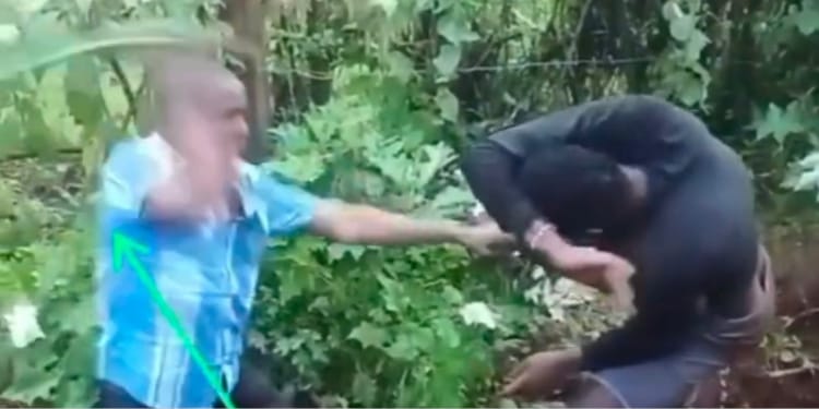 The married man beating another man he found in his house PHOTO/FB