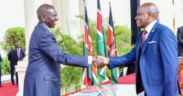 Dennis Itumbi shakes President William Ruto's hand