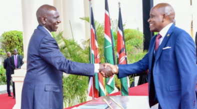 Dennis Itumbi shakes President William Ruto's hand