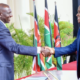 Dennis Itumbi shakes President William Ruto's hand