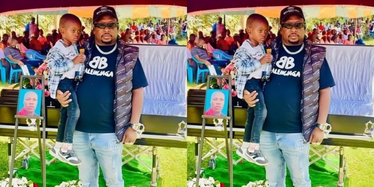 Sonko and Baby James during the burial of his father. Photo/ Dan Chepta/ x