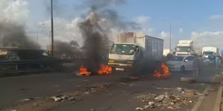 A lorry is being burnt along Thika Road during the fuel price hike protest. Photo/ file 