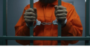Photo of a man in a police cell with handcuffs. PHOTO/ File