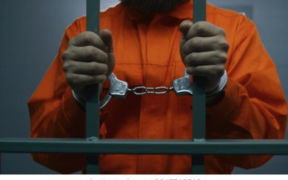 Photo of a man in a police cell with handcuffs. PHOTO/ File