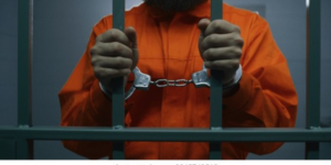 Photo of a man in a police cell with handcuffs. PHOTO/ File