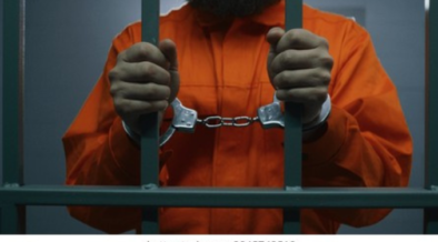 Photo of a man in a police cell with handcuffs. PHOTO/ File
