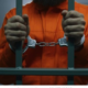 Photo of a man in a police cell with handcuffs. PHOTO/ File