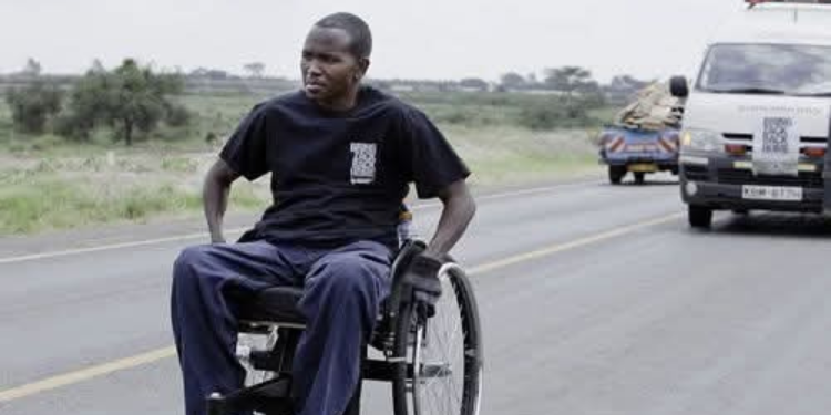 Zack Kimotho travelling to South Africa in his wheelchair in 2012 to raise funds for Paraplegic Centre PHOTO/Nation