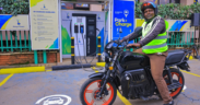 A motorbike rider with an electric bike in a KPLC charging station in Nairobi. PHOTO/ File