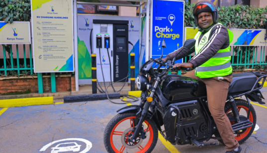 A motorbike rider with an electric bike in a KPLC charging station in Nairobi. PHOTO/ File