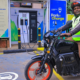A motorbike rider with an electric bike in a KPLC charging station in Nairobi. PHOTO/ File