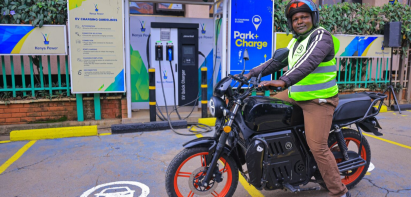 A motorbike rider with an electric bike in a KPLC charging station in Nairobi. PHOTO/ File