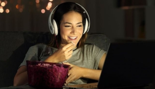 A girl watching a Movie. PHOTO/ Pinterest