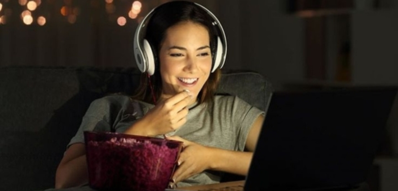 A girl watching a Movie. PHOTO/ Pinterest