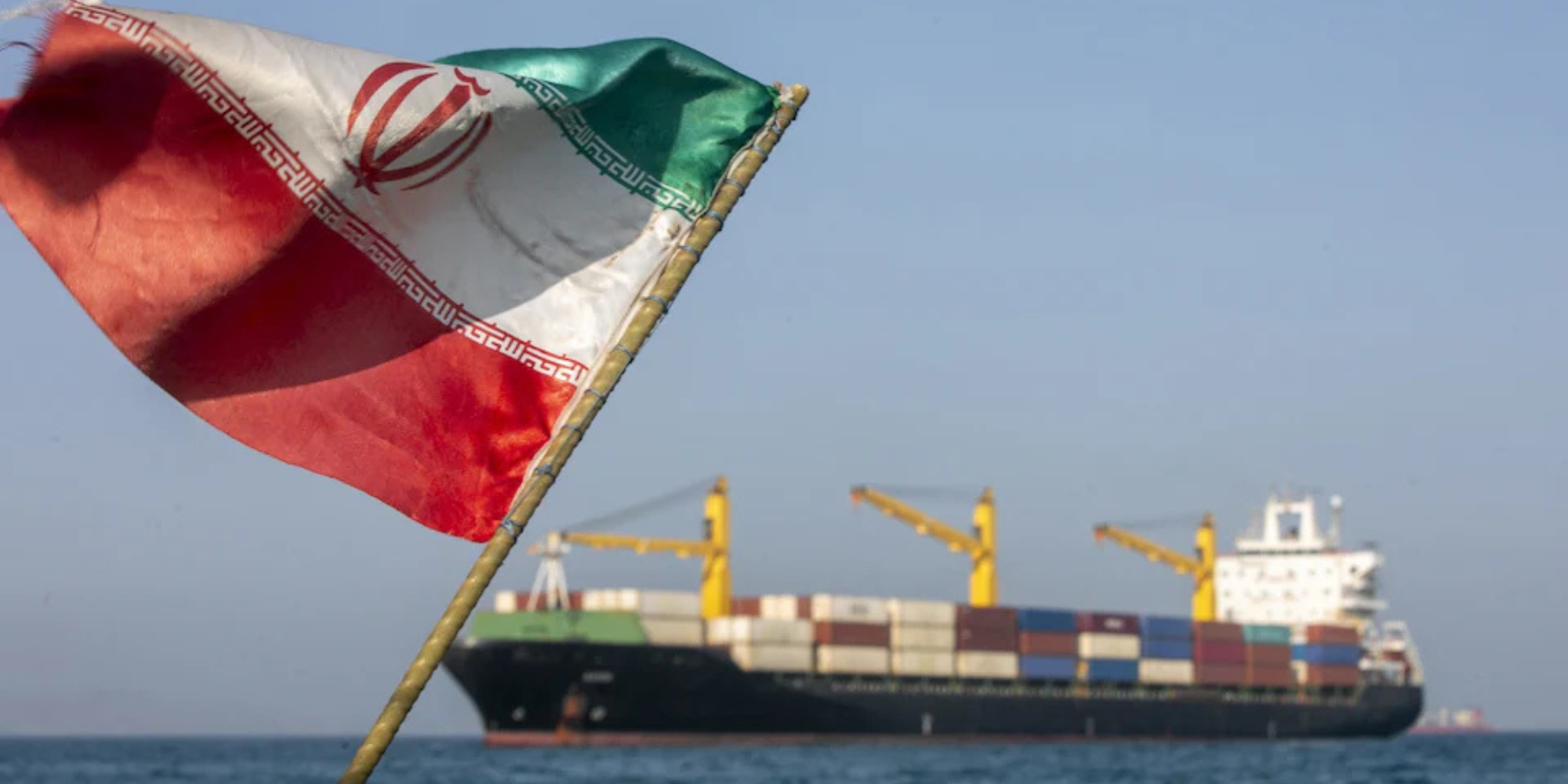 A picture of Iran's flag and the strait of Hormuz PHOTO/Reuters
