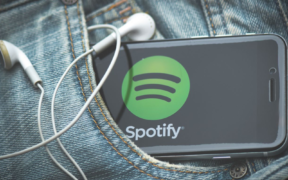 A phone in someone's pocket bearing the logo of Spotify with earphones on it. PHOTO/ File