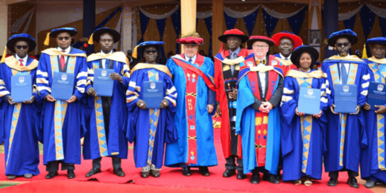 MKU PhD graduates pose for a photo with the Dr. Karim Khan, ICC Prosecutor, Chancellor Prof. John Struthers and Prof. JAGANYI, MKU Vice-Chancellor.