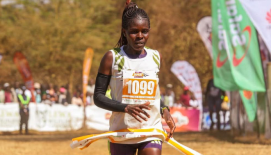 KWS officer Lydia Simiyu, bib 1099, breaks the tape to win the women’s 42km race at the 26th Lewa Safari Marathon in Isiolo on 27 June 2026.