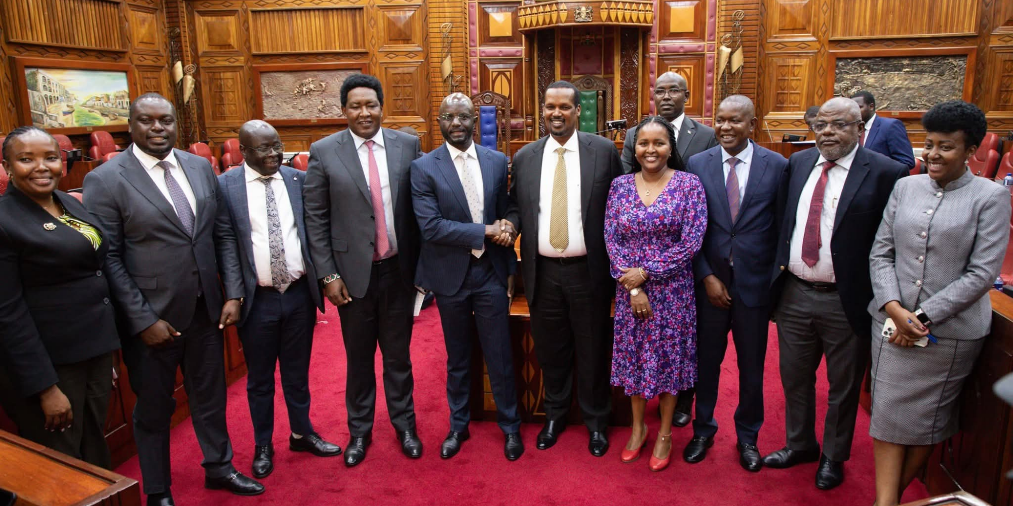Kenyan lawmakers celebrate inside Parliament Buildings in Nairobi after the Mediation Committee reaches a landmark Ksh 428 billion revenue-sharing agreement for counties. PHOTO/ Parliament of Kenya