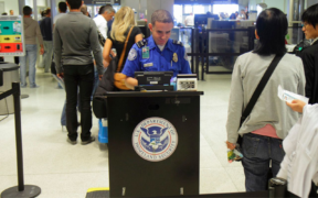 A security officer from the US Department of Homeland Security conducts a security check at the airport for those visiting the US. PHOTO/ DHS