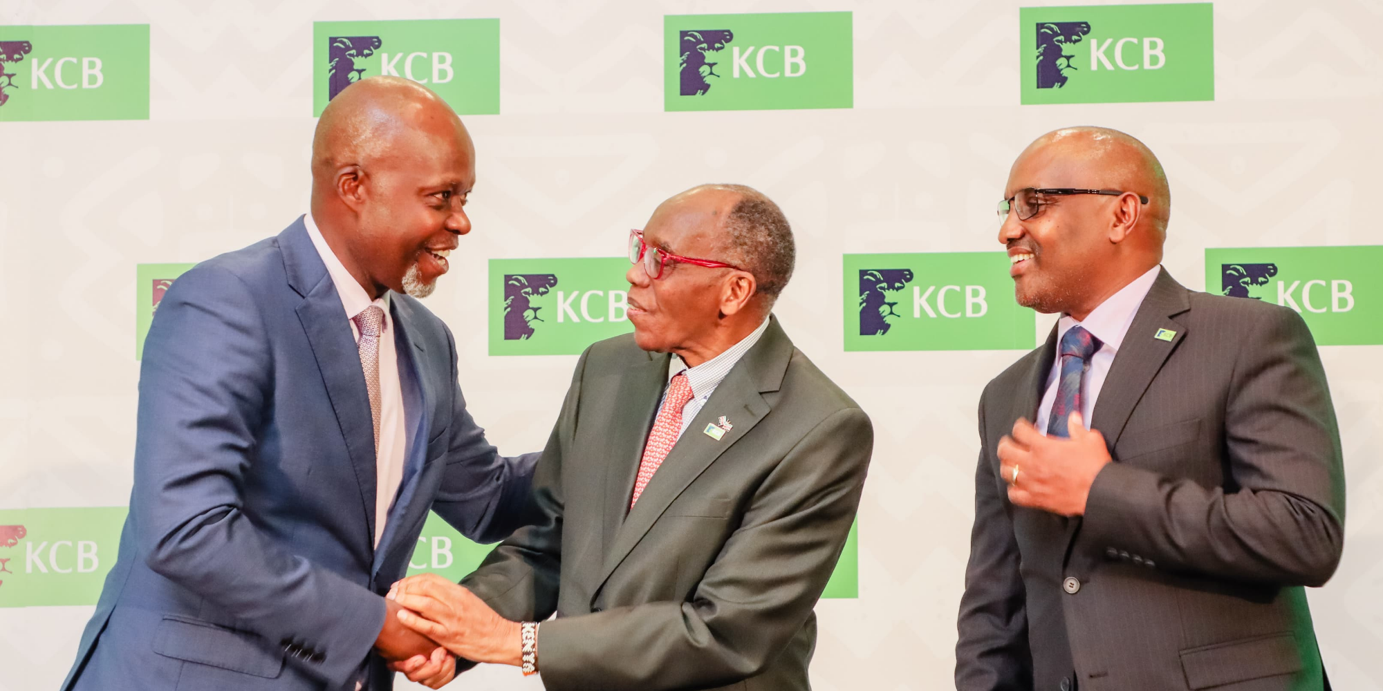 From Left: KCB Group Finance Director, Lawrence Kimathi, Group Chairman, Dr. Joseph Kinyua and Group CEO, Paul Russo share a light moment during a past event. PHOTO/FILE.