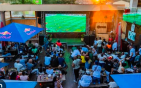 Football fans gather at an open restaurant to watch a football match. PHOTO/ File