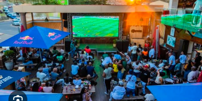 Football fans gather at an open restaurant to watch a football match. PHOTO/ File