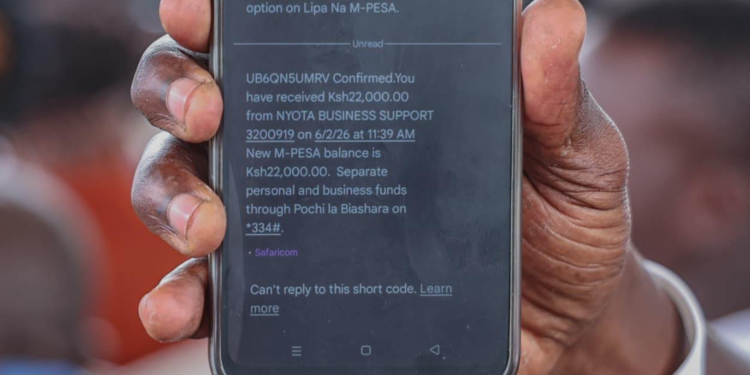 A person showing money received from NYOTAPHOTO/Standard