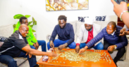 Ol Kalou residents join Nyandarua Senator John Methu as they count Ksh 10 contributions collected to buy a suit for MP aspirant Sammy Ngotho, turning an insult into a show of unity ahead of the by-election. PHOTO/ Citizen Digital
