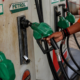 Fuel station attendant returning a fuel pump after fuelling in Kenya. Photo/ file