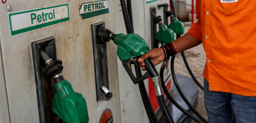 Fuel station attendant returning a fuel pump after fuelling in Kenya. Photo/ file