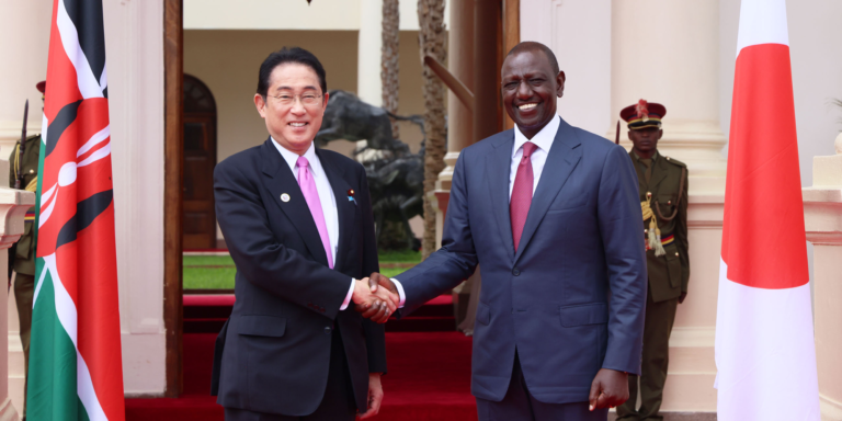 Japanese Prime Minister Kishida receiving greetings from President William Ruto during his state visit to Kenya in May 2023