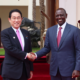 Japanese Prime Minister Kishida receiving greetings from President William Ruto during his state visit to Kenya in May 2023