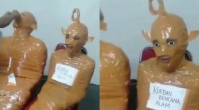 Thieves turned into “Teletubbies” after Indonesian locals wrapped them entirely in tape, sparking mixed reactions online after the viral video. PHOTO/ Screengrab