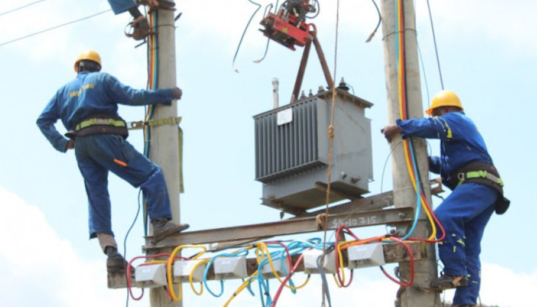 Kenya Power and Lighting Company personnel installing a transformer in undisclosed location in Kenya. PHOTO/ File