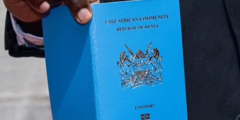 Photo of a Kenyan man holding a passport. PHOTO/ Directorate of Immigration Services