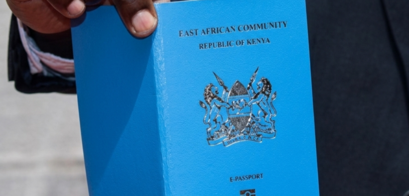 Photo of a Kenyan man holding a passport. PHOTO/ Directorate of Immigration Services