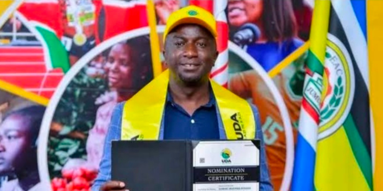 Samuel Muchina being given a certificate to be able to vie for Ol Kalou MPPHOTO/Standard