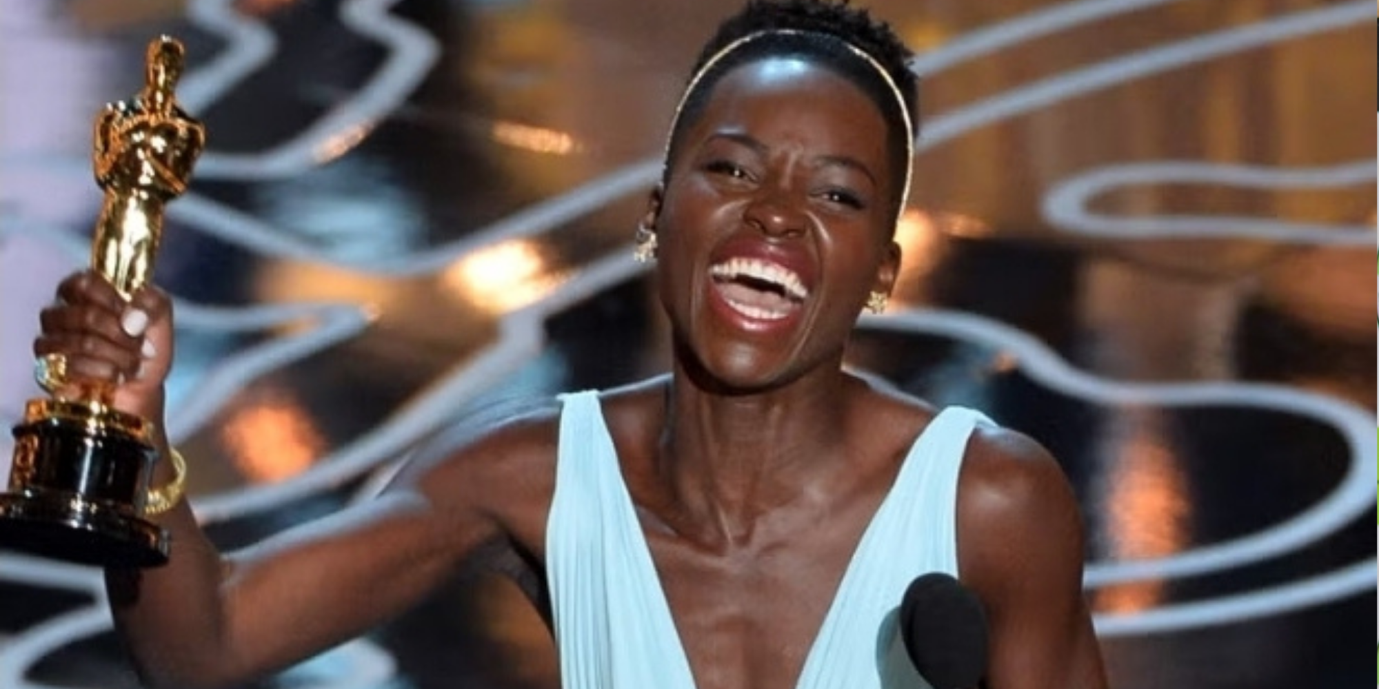 Lupita Amondi Nyong’o accepts her first Oscar for 12 Years a Slave at the 2014 Academy Awards. PHOTO/Kevin Winter, Getty Images
