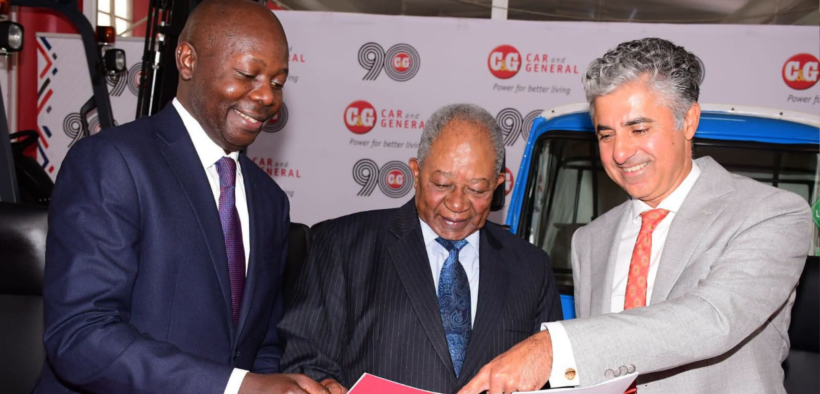 A photo of Car & General Board Chairman Nicholas Ng’ang’a (centre), Group CEO Vijay Gidoomal (right), and Director Carey Ngini review a report during the company's 86th Annual General Meeting on June 23, 2026. PHOTO/ Car and General Facebook