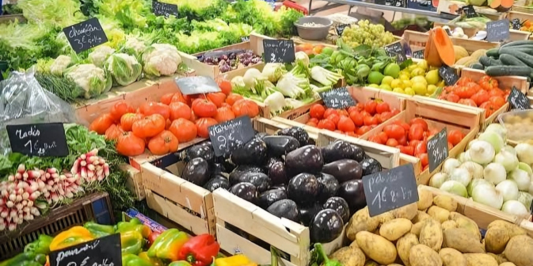 A photo showing tomatoes and vegetables at the market . Photo / File