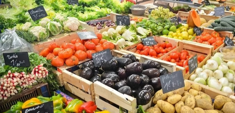 A photo showing tomatoes and vegetables at the market . Photo / File