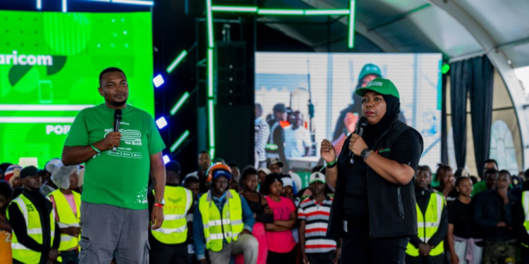 Fawzia Ali with a Safaricom customer in the event PHOTO/File