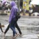 Kenyans walking in the rain PHOTO/Standard
